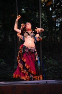 Two FatChanceBellyDance fusion style belly dancers, in earthy costumes with heavy jewellery.